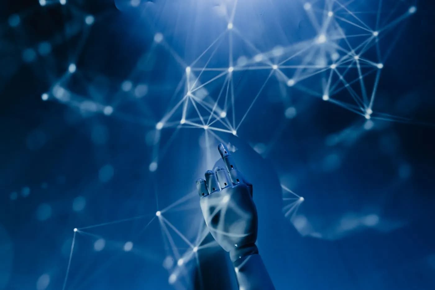 Robotic hand reaching toward a glowing neural network of connected data nodes